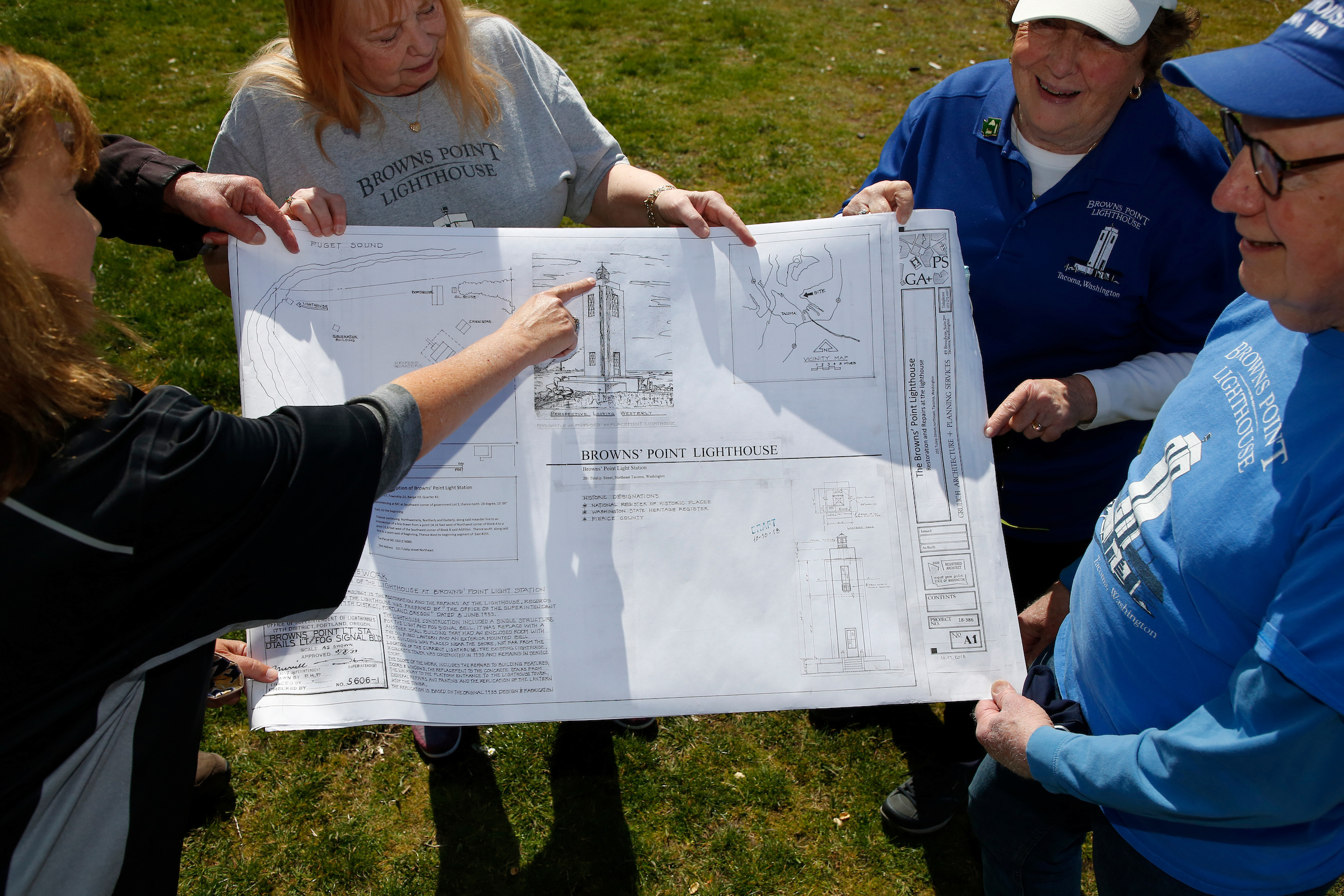photo of man and women holding a blueprint